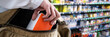 © Andrey Popov - Retail Shoplifting. Woman Stealing In Supermarket. Theft