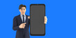 Young business character isolated on blue background. wear blue shirt blue necktie looks at camera. Presentation shows smart phone  .3D Rendering.	
