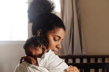 Mother holding a newborn.