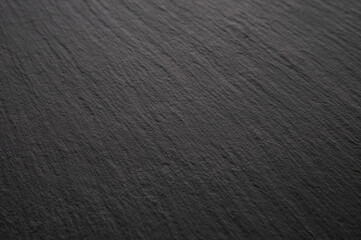 Black stone slate background, textured dark surface