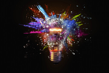 Wall Mural - Electric light bulb exploding with paint and glass, a creative idea. Business and technology. Think different, concept. New thinking and brainstorming
