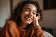 Joyful Relaxation: Young Woman Laughing in Cozy Home Setting. Genuine, Warm, and Inviting Ambiance Captured in Candid Shot. Relaxing at home. Generative AI