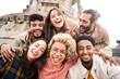 © CarlosBarquero - International students with beaming smiles are posing for selfie shot outdoors in university campus. Cheerful, smart and successful youth. High quality photo