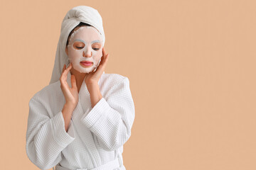 Poster - Young woman in bathrobe with sheet mask on beige background