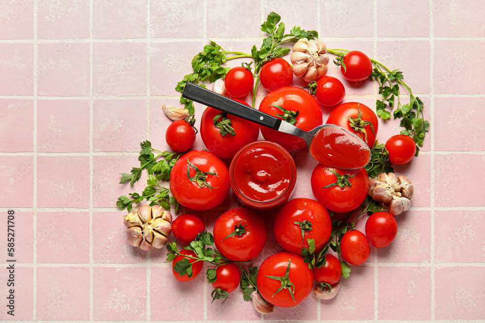 Jar with tasty ketchup and fresh vegetables on pink tile background