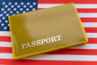 Flag of USA with passport. Travel visa and citizenship concept. residence permit in the country. a yellow document with the inscription passport is on flag. Close up, top view