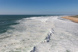 Fototapeta Morze - Sea waves cover the seashore