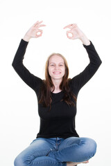 Wall Mural - blonde woman sitting young beauty on white background in yoga position