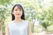 © buritora - 新緑の中ワクワクする日本人女性（笑顔）