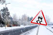 © New Africa - Highway with Slippery Surface road sign on snowy day, space for text