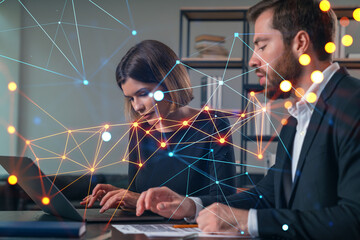Wall Mural - thoughtful businesspeople typing on laptop at office workplace. concept of team work, business educa