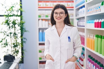 Sticker - Young caucasian woman pharmacist smiling confident standing at pharmacy