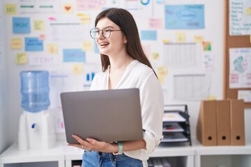 Wall Mural - Young caucasian woman business worker using laptop working at office