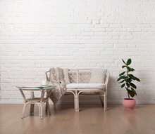 Country Style Rattan Living Room Loveseat On White Brick Wall Background