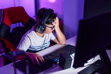 Sticker - Adorable hispanic boy streamer stressed using computer at gaming room