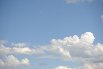 Background with white clouds on blue sky at daytime 