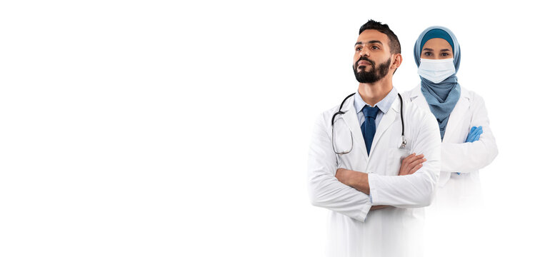 Wall Mural - Arab Male And Female Doctor In Uniform Posing Isolated Over White Background