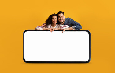 Poster - Happy Arab Couple Leaning At Big Smartphone With Blank White Screen