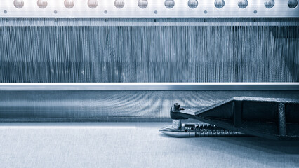 Fototapete - straight strands texture background, sewing equipment, loom equipment at a garment factorymachine