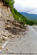Limestone rockfall and landslide fallen and blocking tarmac road leading to Khvamli Mountain peak in Georgia.