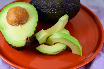 Two fresh ripe raw hass avocados, close up, healthy food concept