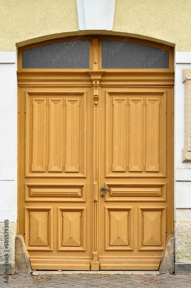 View of old building with wooden door