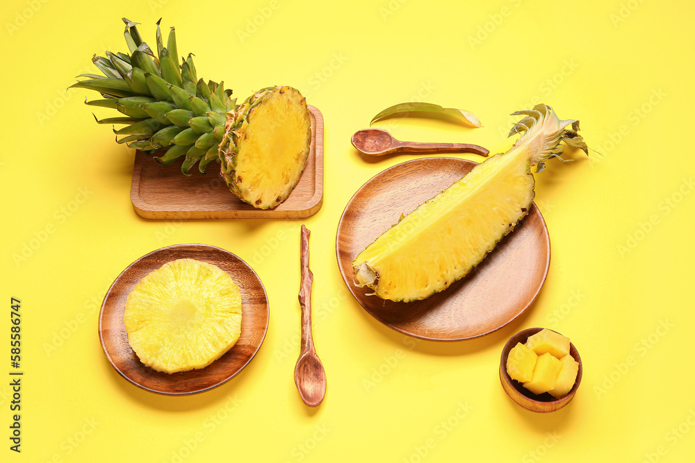 Composition with slices of fresh pineapple on yellow background