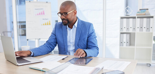 Poster - Black man, business and laptop for corporate planning, strategy or communication at the office desk. African American male CEO working on computer for company statistics, marketing or schedule tasks