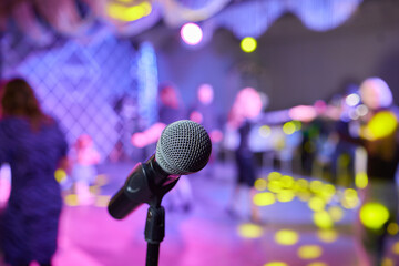 Wall Mural - Retro microphone on stage in a pub or American Bar restaurant during a night show.