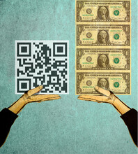 Hands Holding QR Code And Stack Of Dollars