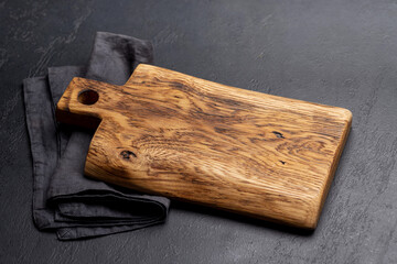 Wooden cutting board and kitchen towel