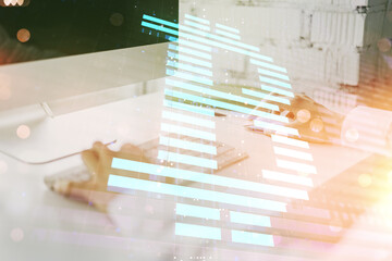 Poster - Double exposure of creative Bitcoin symbol with hands typing on laptop on background. Cryptocurrency concept