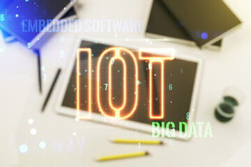Poster - Creative IOT hologram and modern digital tablet on background, internet of things concept. Multiexposure