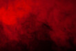 Eerie black background with billowing red smoke