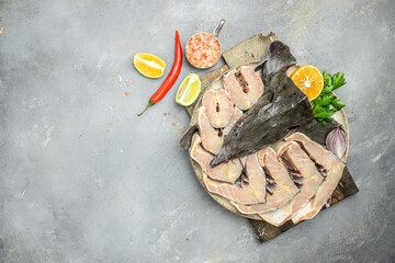 Wall Mural - steaks of large raw sturgeon. Culinary, cooking, bakery concept. banner, menu, recipe place for text, top view