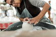 © Astrakan Images - Woman making pottery