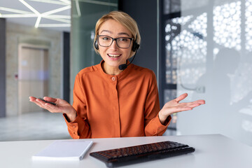 Web camera view, young beautiful female office worker talking remotely with colleagues clients, businesswoman with video call headset on online meeting having fun giving a speech.