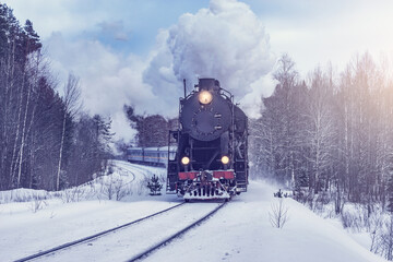 Wall Mural - Retro steam train moves at winter morning.