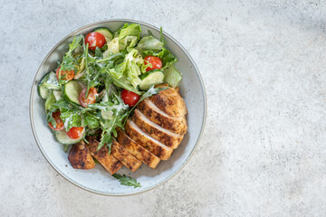 Wall Mural - Green salad with grilled chicken breast. Healthy food, clean eating concept