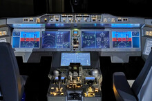 Modern Dashboard With Controls In The Pilot Cockpit Of A Passenger Aircraft.