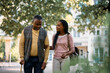 © Drazen - Happy black senior man taking a walk with his daughter through park of nursing home.