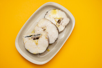 Canvas Print - boiled fresh fish with oil in dish