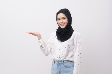 Wall Mural - Portrait of beautiful muslim woman with hijab over white background studio.