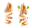 Grilled chicken breast isolated on transparent background png. Grilled chicken slices with pepper mix peas and fresh basil leaves. flying food