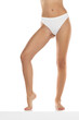 © vladimirfloyd - Perfect female legs in underwear on a white background. Front view