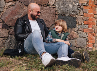 Wall Mural - Portrait of father and son outdoors