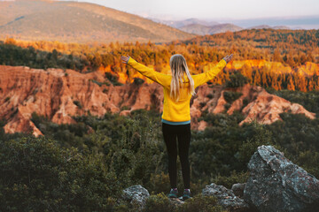 Woman hiking outdoor raised hands enjoying canyon view in Albania travel lifestyle hiker in mountains active summer vacations trip