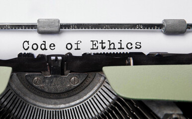 Poster - text code of ethics typed on retro typewriter