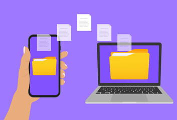 file transfer. hand holding smartphone with folder on screen and documents transferred to laptop. co