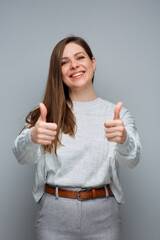 Wall Mural - Smiling cheerful girl show thumbs up. like symbol. isolated female portrait.